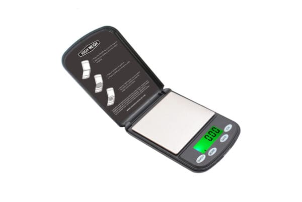 Black and silver digital pocket scale.