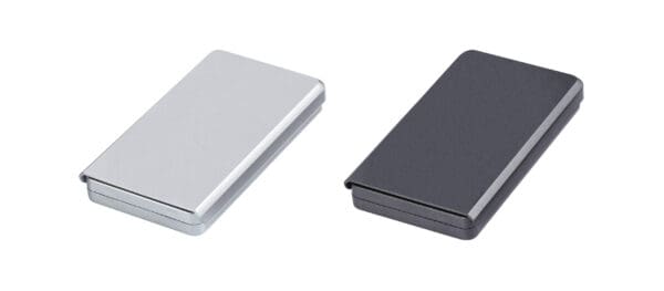 Two silver and black colored portable hard drives.