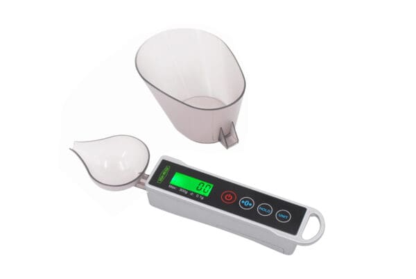 A VBD 300 Spoon Digital Pocket Scale with a cup next to it.