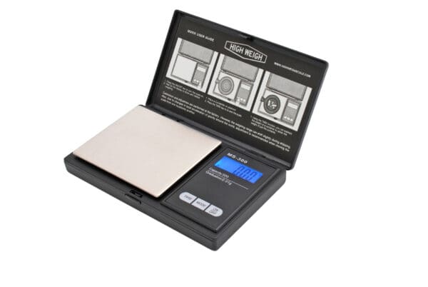 A VBR750 Classic Digital Pocket Scale with a box on top of it.
