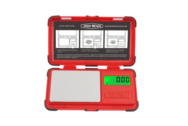 Black and red digital pocket scale with green display.