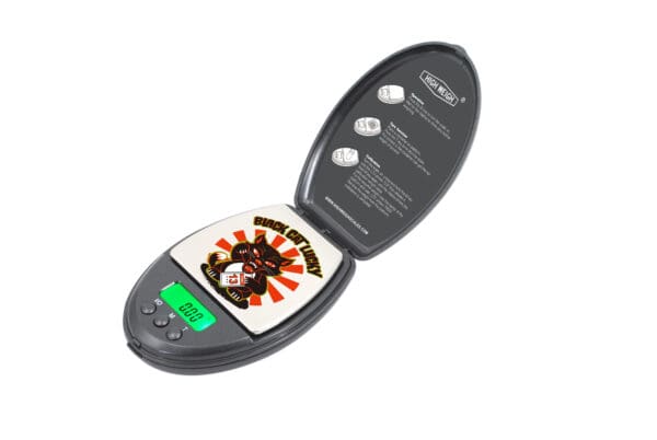 A Black Cat 100 Digital Pocket Scale with a picture on it.