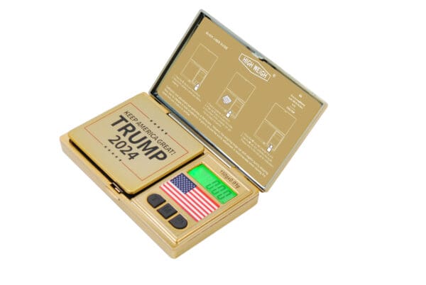 A gold box with a TRMP 150 Digital Pocket Scale in it.