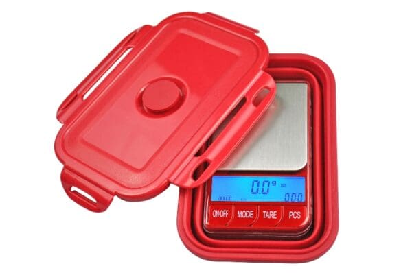 A red plastic container with a RM-BOWL Style Large Display Digital Pocket Scale.